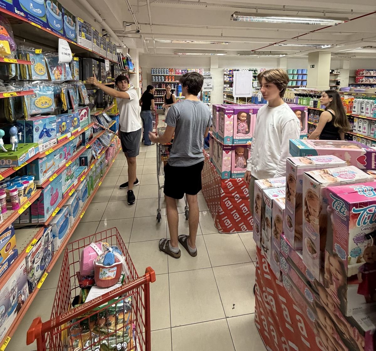 Members filling shopping carts with toys before the Christmas visit